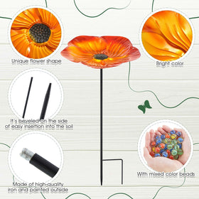 Outdoor garden decor blends with flowers and greenery for charm
