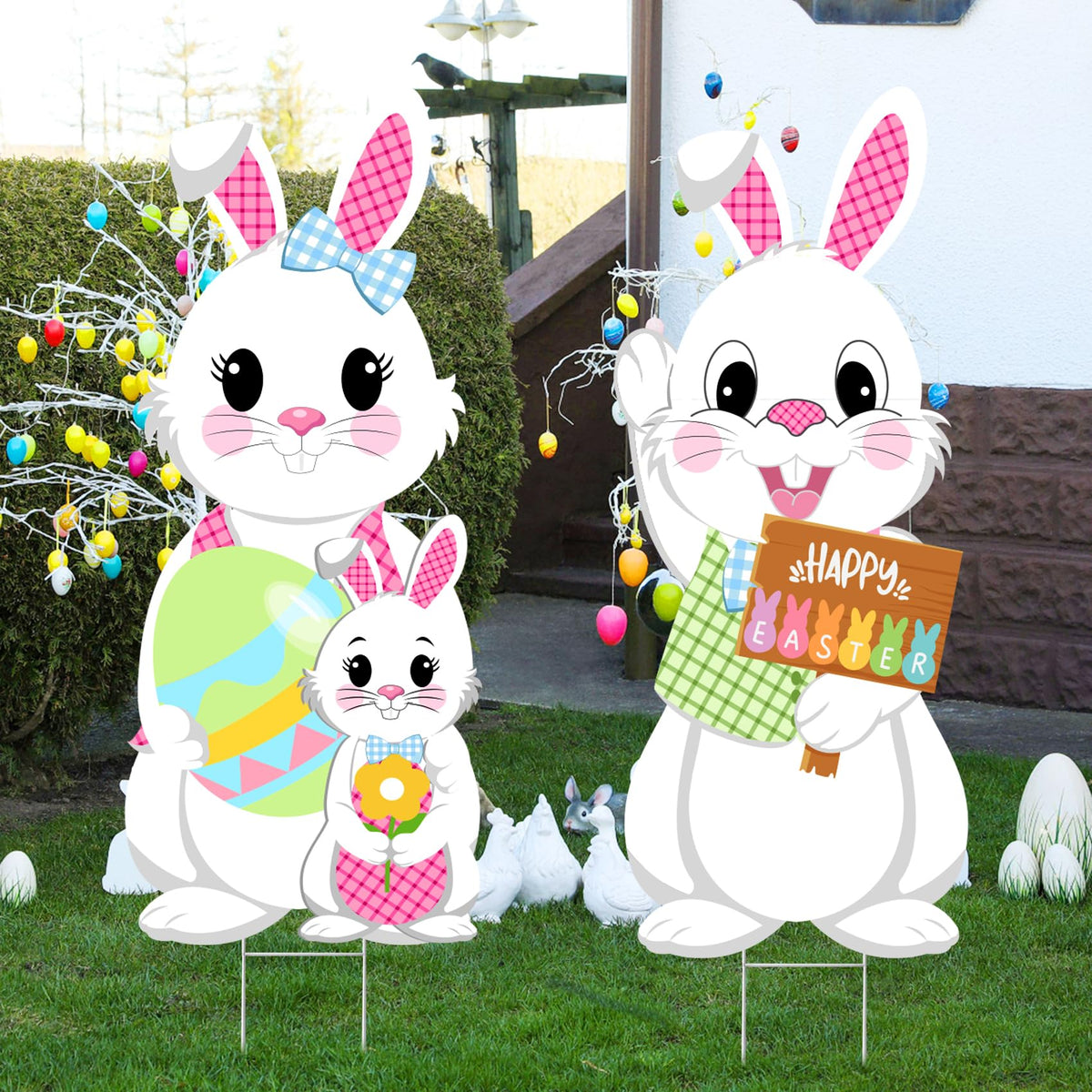 Taupphoo yard sign in grass by driveway creates a friendly spring scene.