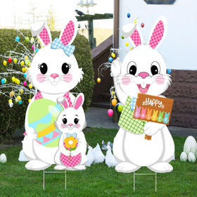Taupphoo yard sign in grass by driveway creates a friendly spring scene.