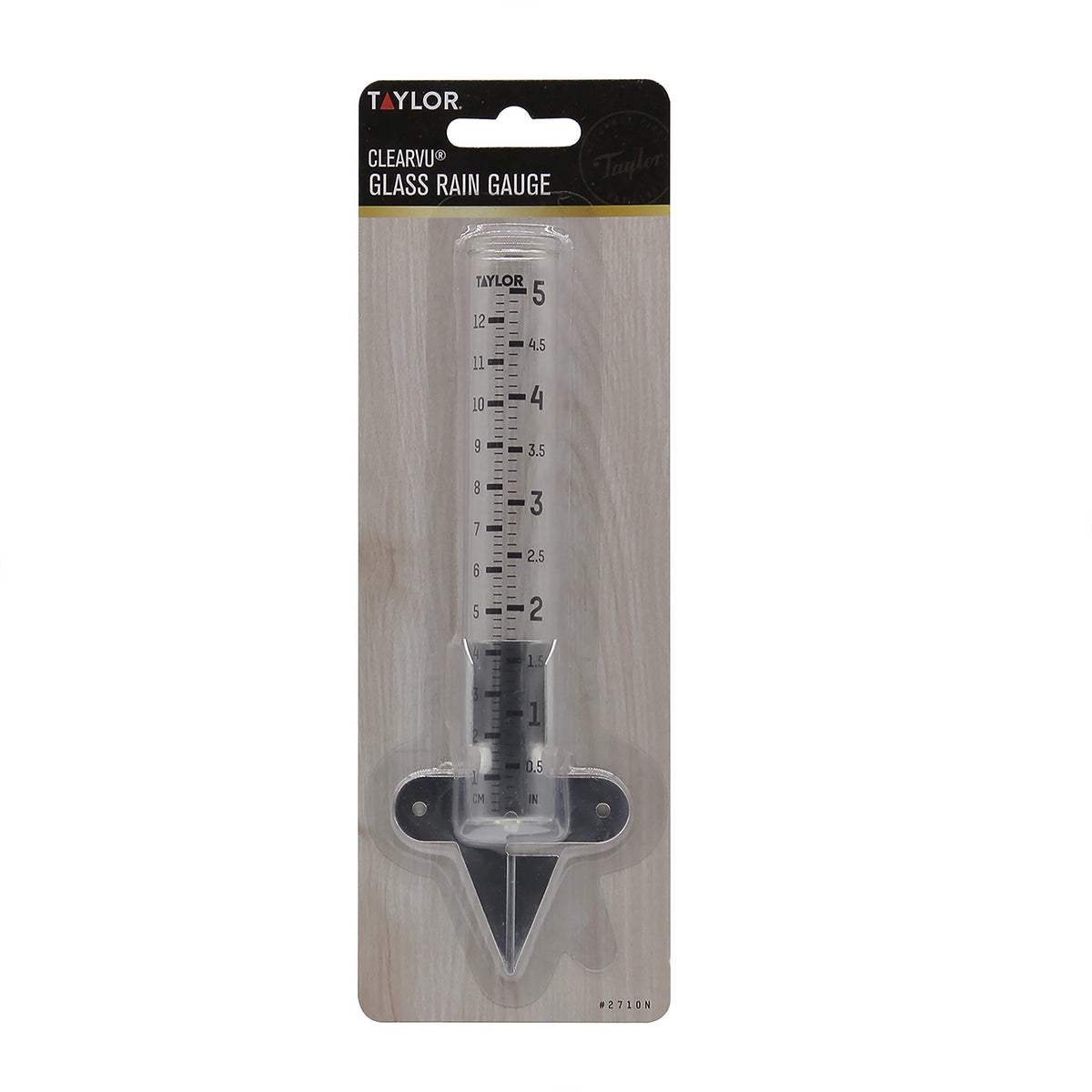 Taylor rain gauge in garden setting for tracking irrigation and rainfall
