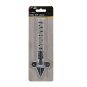 Taylor rain gauge in garden setting for tracking irrigation and rainfall