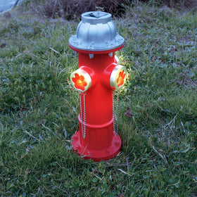 TB TIBAG fake fire hydrant dog pee post guiding pets to a designated bathroom area.