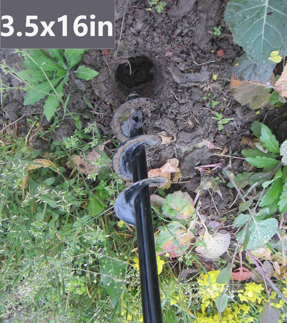 TCBWFY garden auger in use with a power drill
