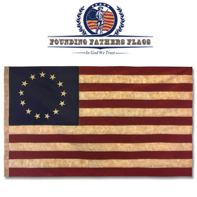 Betsy Ross flag with tea-stain vintage look enhances period-style decor