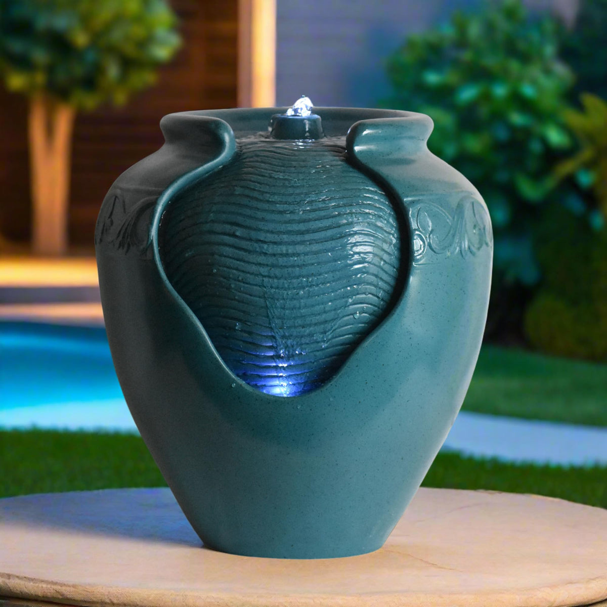 Teamson Home teal pot fountain as garden decor centerpiece at outdoor space.