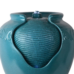 Teamson Home teal pot fountain with pump and cord ready for setup.