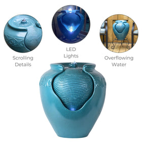 Teamson Home teal pot fountain showing water flow over wave texture.