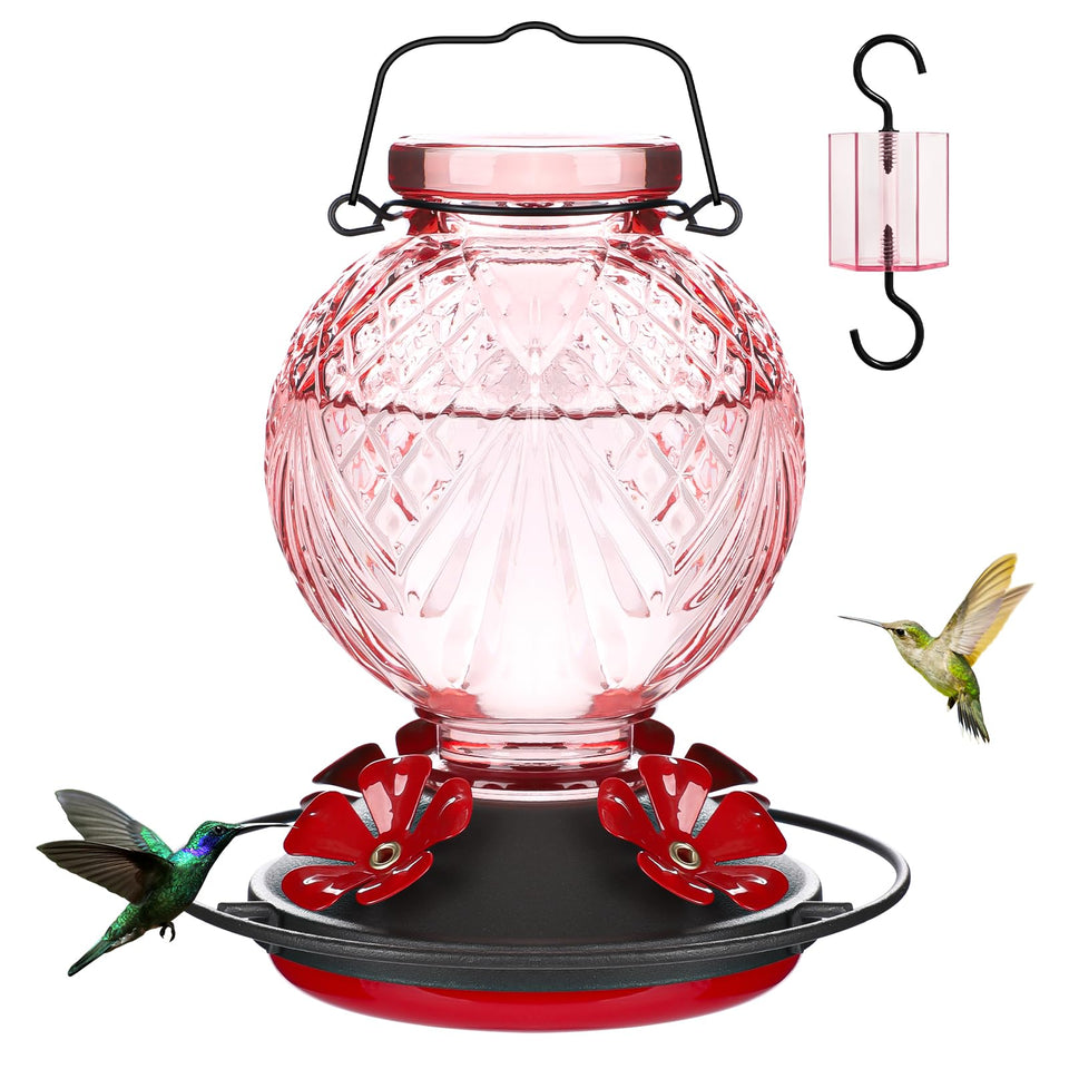 Tegarbed pink glass hummingbird feeder offers durable year-round outdoor decor.
