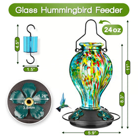Tegarbed feeder includes an ant moat to deter nectar intruders.