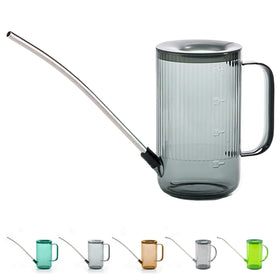 Tennedriv Green grey watering can on window sill supports quick plant care.