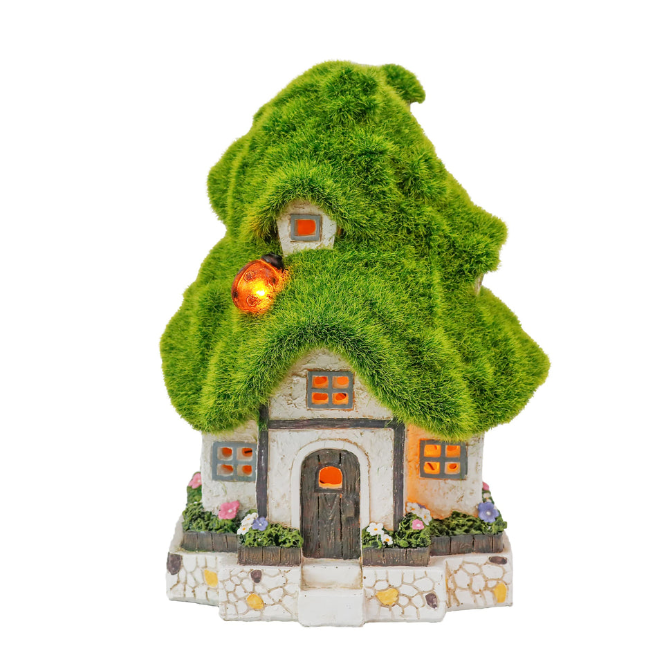 Teresa's Collections fairy house with moss roof enhances garden charm.