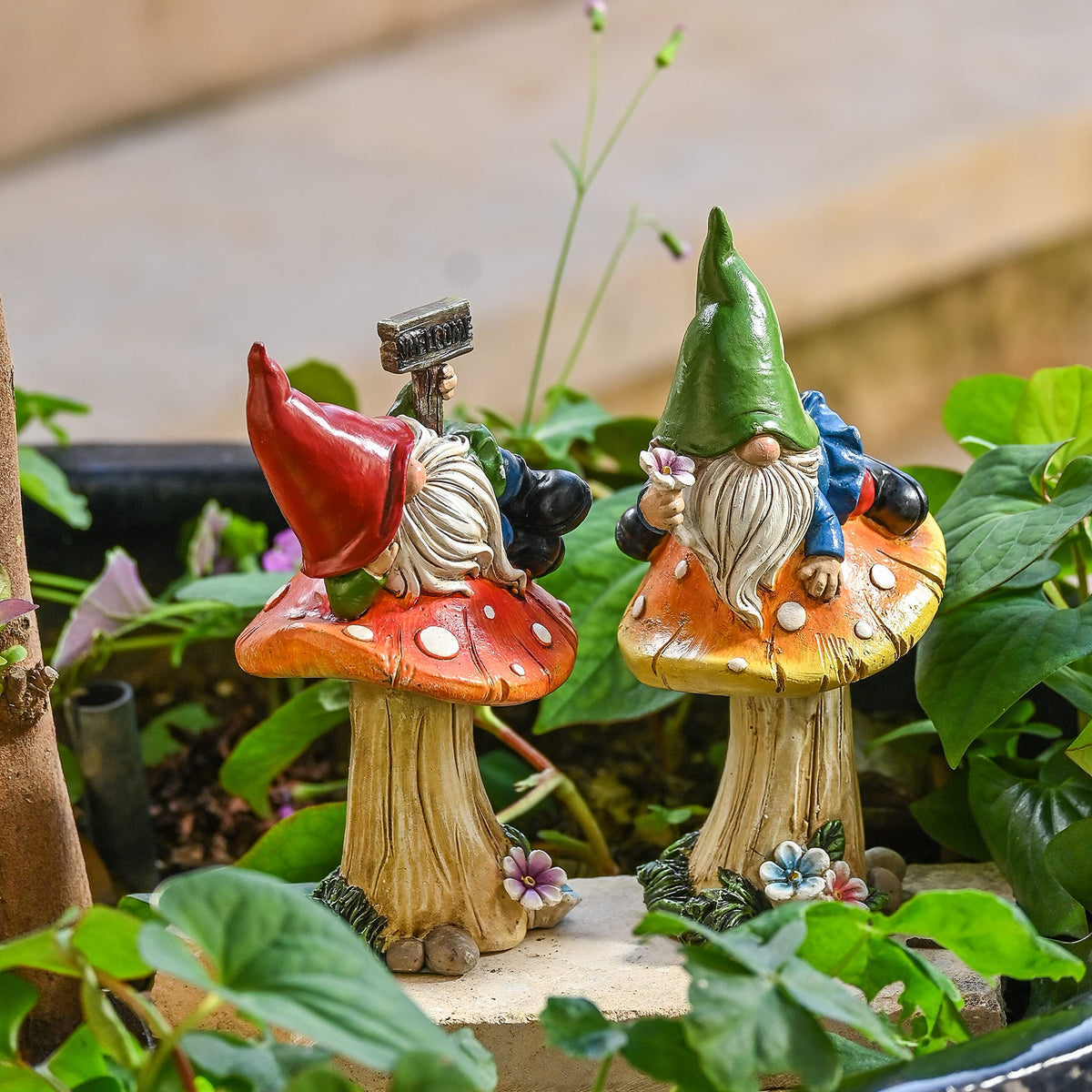 TERESA'S COLLECTIONS gnomes perched on a mushroom bring whimsy to outdoor spaces.