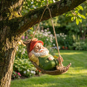 TERESA'S COLLECTIONS Tree-hanging gnome adds charm to porches and patios.