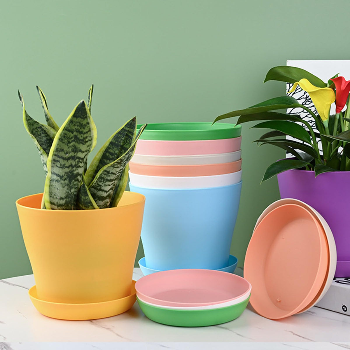 Tergy 7 inch plant pots with saucers keep surfaces clean and spill-free.