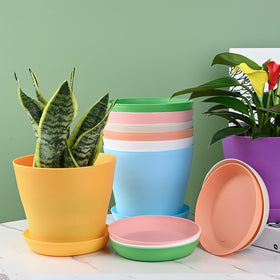 Tergy 7 inch plant pots with saucers keep surfaces clean and spill-free.