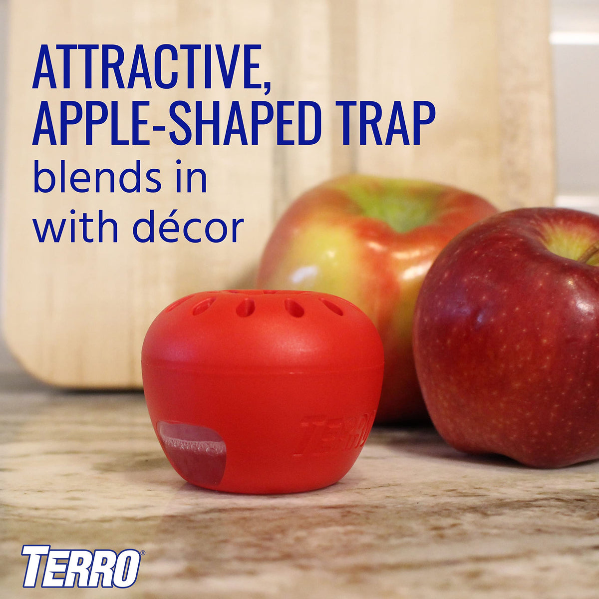 Apple-shaped Terro trap blending with fruit on the counter