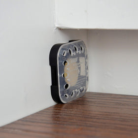 Terro T500SR multi-surface adhesive strips secure placement on walls and cabinets.