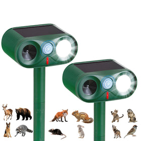 TFKK solar ultrasonic animal repeller with strobe light deters wildlife in gardens.