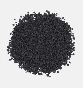 The Andersons BioChar DG granules dispersing in soil for even coverage.
