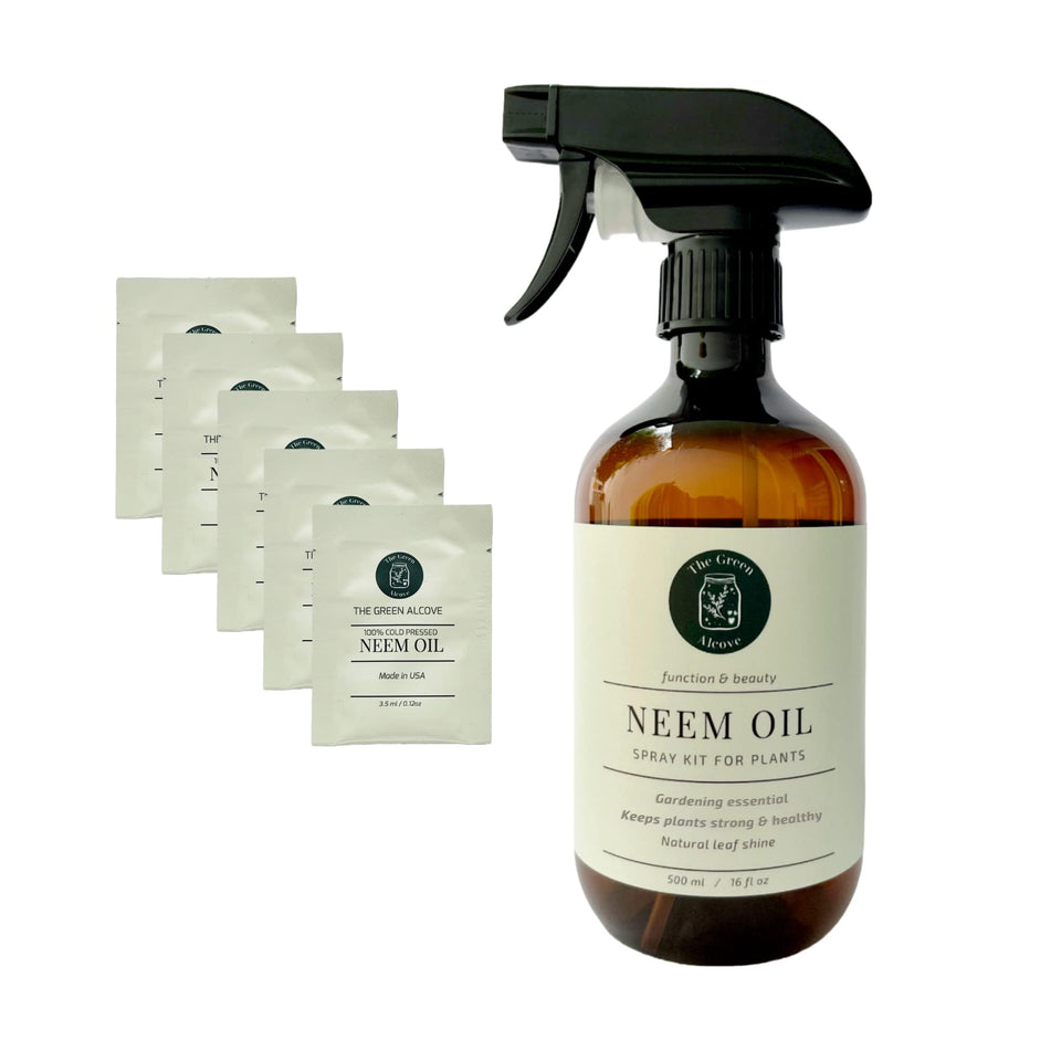The Green Alcove neem oil spray bottle for indoor and outdoor plant care.