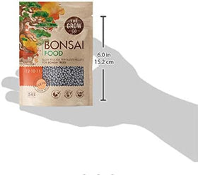 Close-up of The Grow Co Bonsai Fertilizer pellets showing granular texture