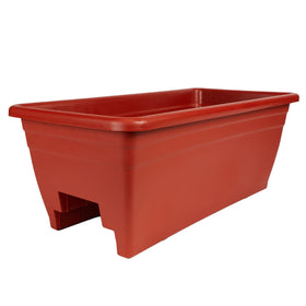 The HC Companies 24-inch deck rail planter on a deck rail, ideal for flowers on a patio.
