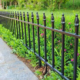 Thealyn garden border fence along a walkway creates a clean edge for pathways.