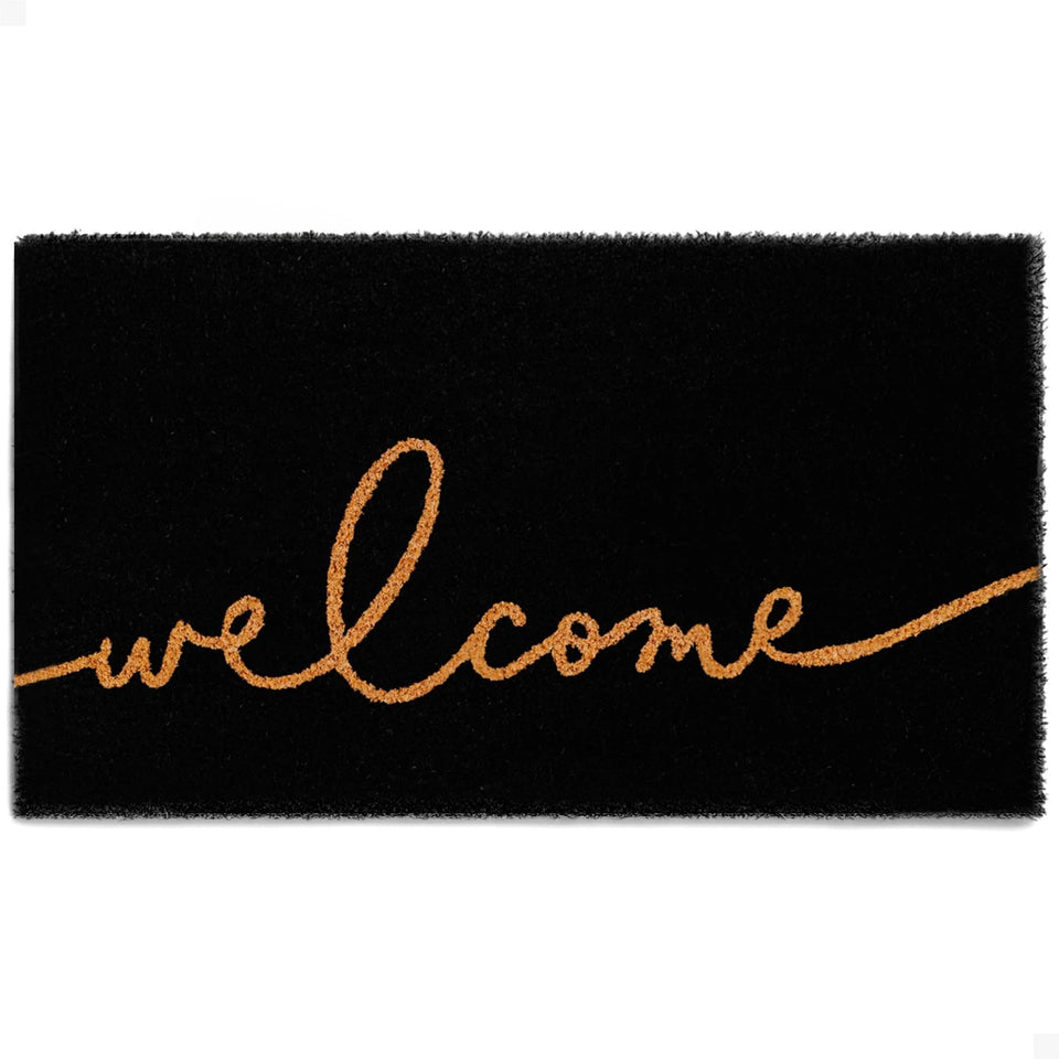The Theodore Magnus door mat with natural coir texture traps dirt at the doorway.