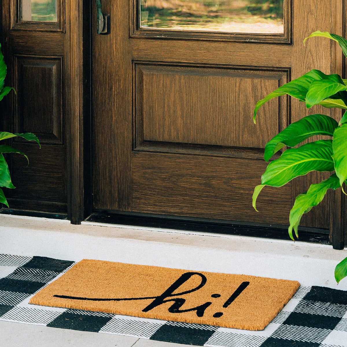 Theodore Magnus mat with non-slip backing maintains entryway stability.