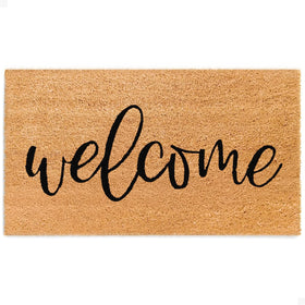 The Theodore Magnus door mat greets guests at the front door with style.