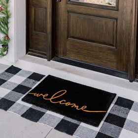 Theodore Magnus entrance mat designed for outdoor use to withstand weather while welcoming guests.