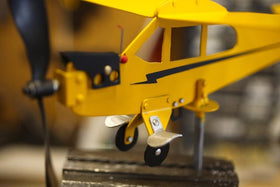 Thyggzjbs Piper J3 Cub weathervane set in a yard decor scene for flight lovers