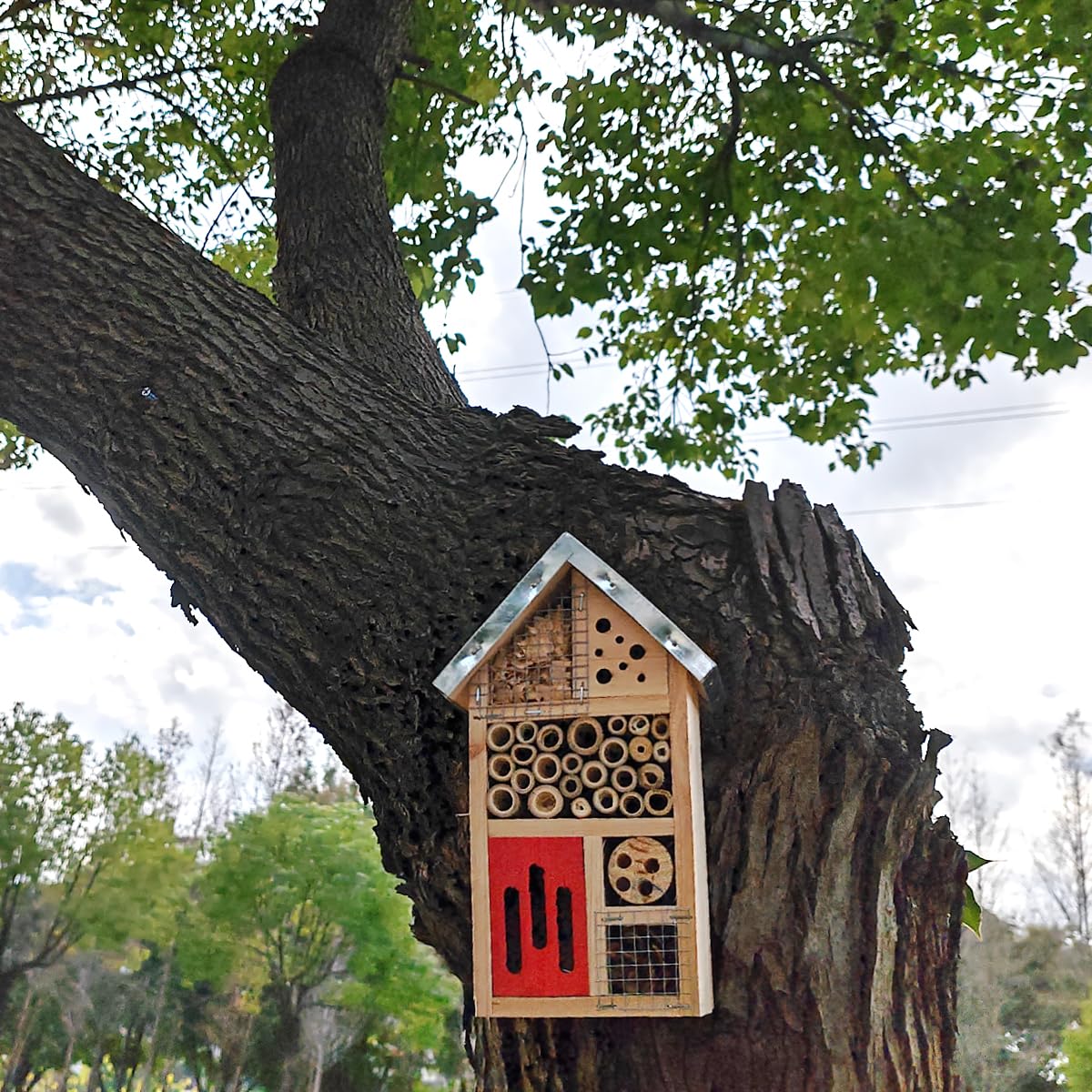 TIHOOD butterfly hotel in a sunlit garden encouraging biodiversity and rest.