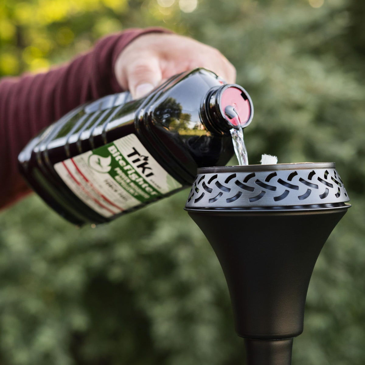 TIKI BiteFighter ten-canisters-fill shows long-lasting outdoor ambiance with all torches.