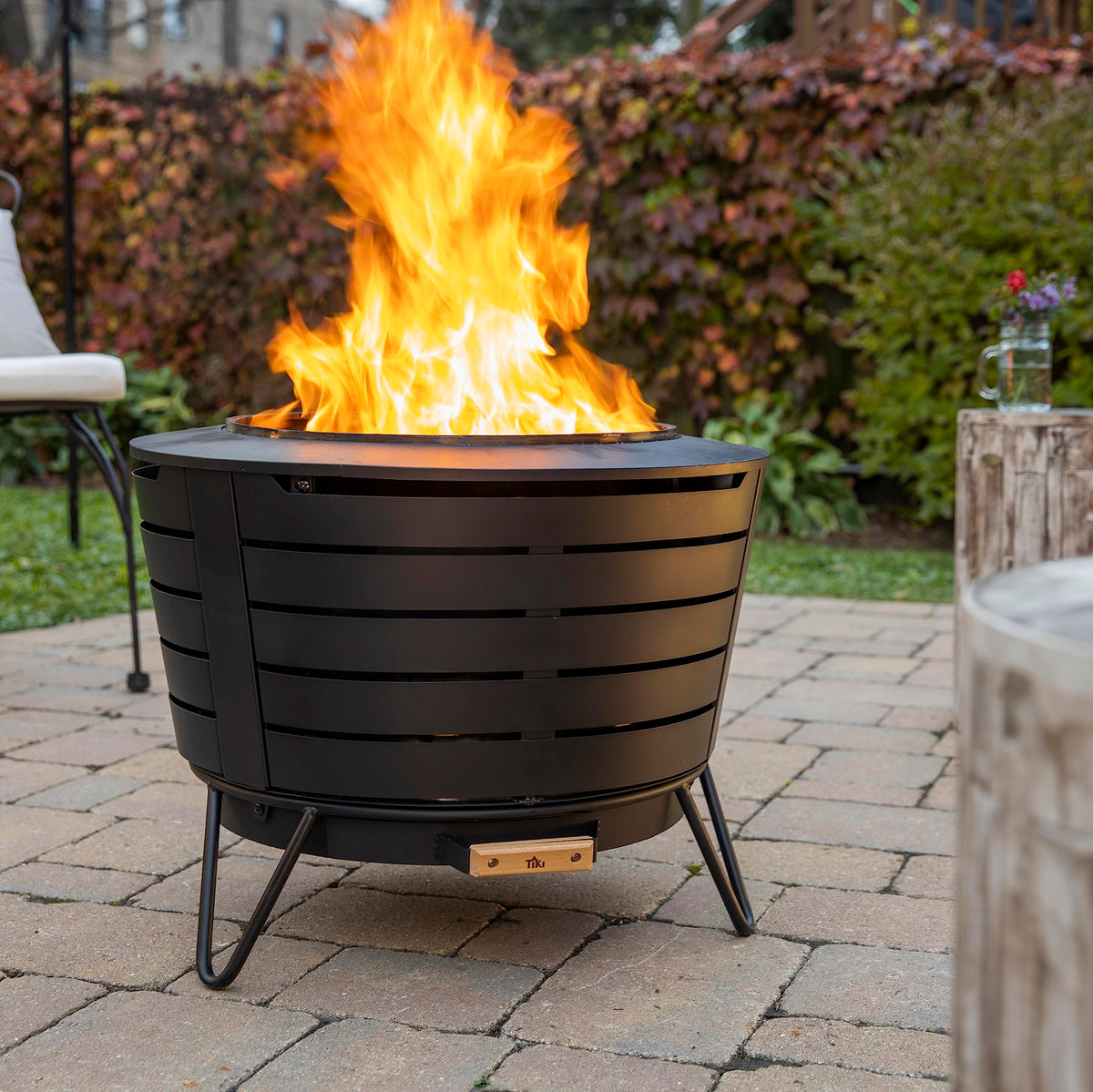 TIKI Patio Smokeless Fire Pit with clean, bright flames for relaxing evenings.