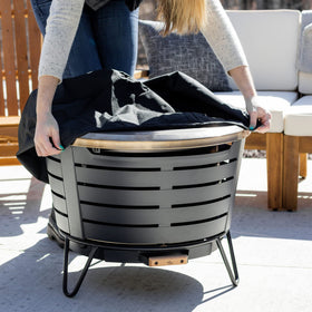 TIKI weather-resistant fire pit cover provides reliable protection between gatherings.