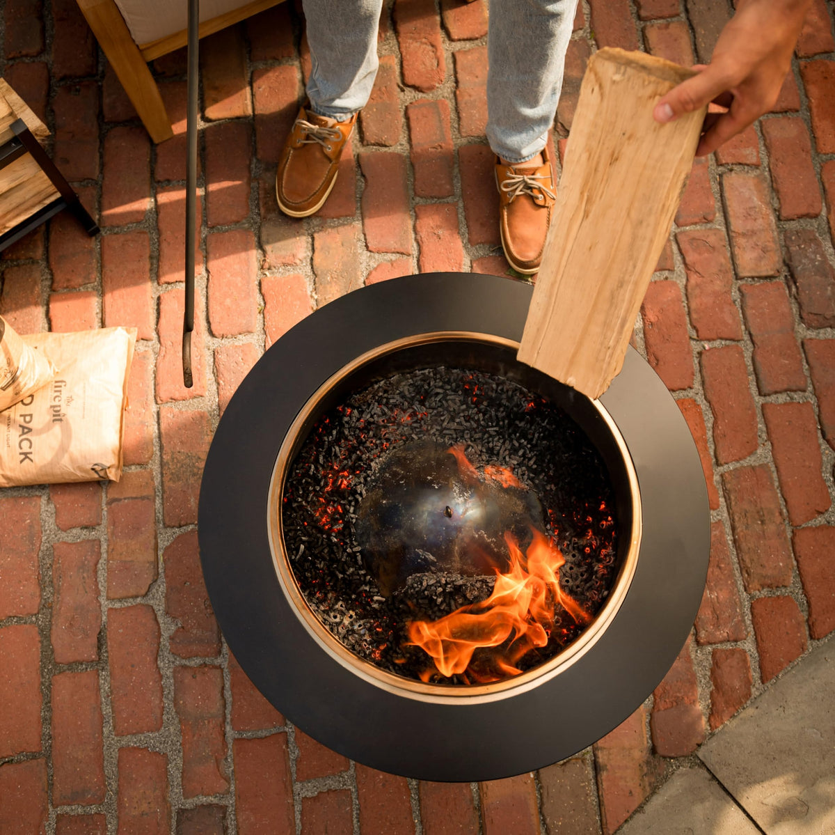 Backyard setup with TIKI Wood Pack, eco-friendly pellets in use