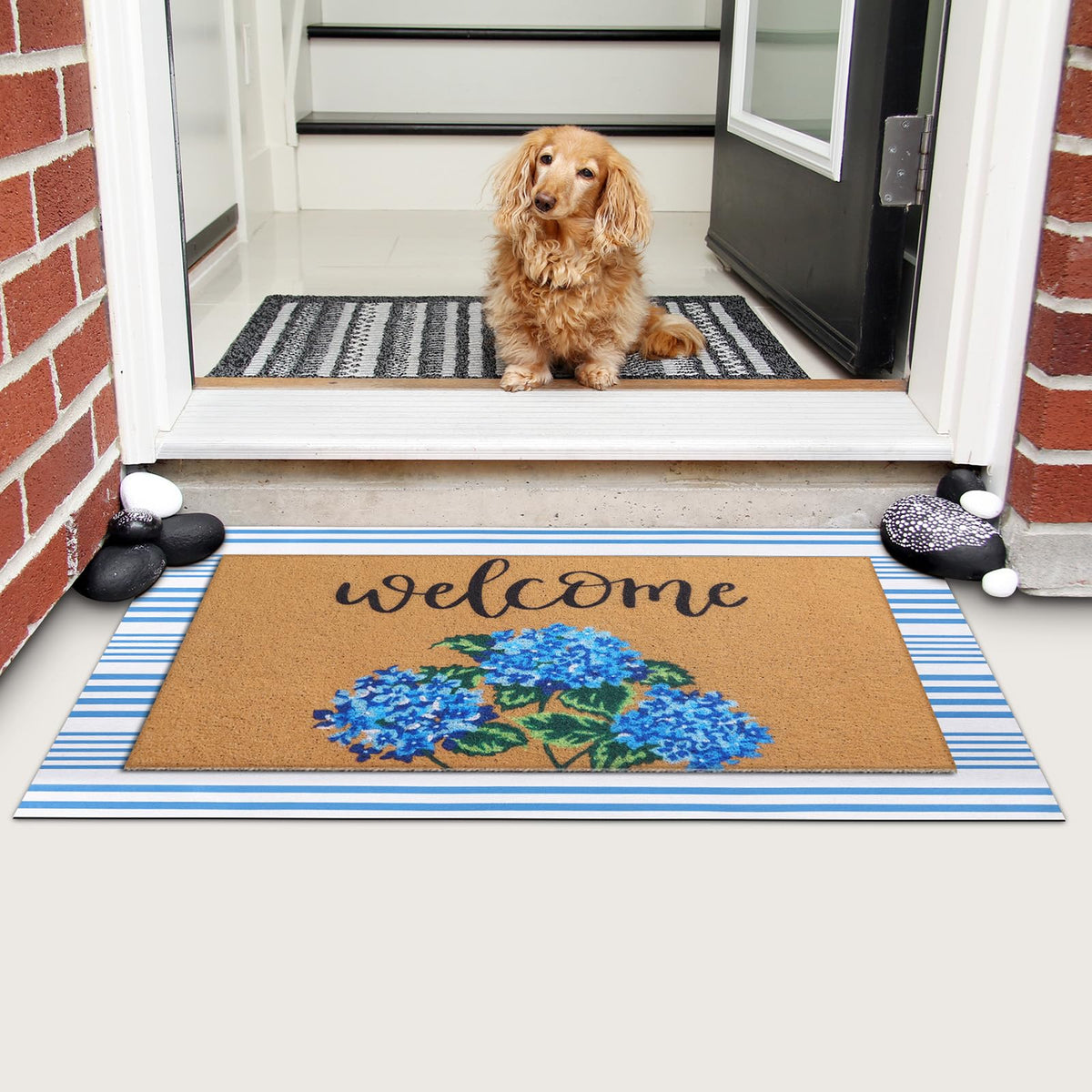 Tinideya mat positioned at a threshold for outdoor-indoor use.