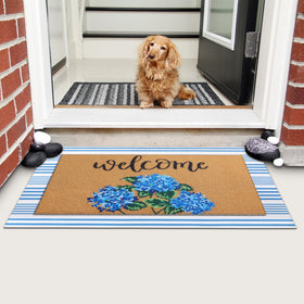 Tinideya mat positioned at a threshold for outdoor-indoor use.