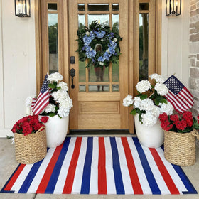 Tinideya waterproof plastic straw rug stands up to outdoor use and easy cleaning.