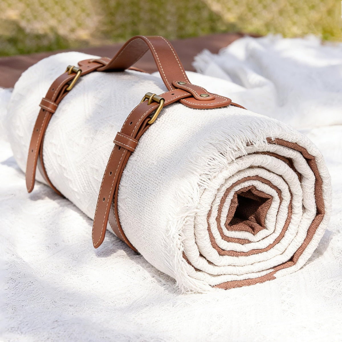 Tiny Land 2-in-1 picnic blanket folds for easy transport.
