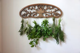 Tnstbiee Tree of Life drying rack installed on wall blending rustic kitchen decor