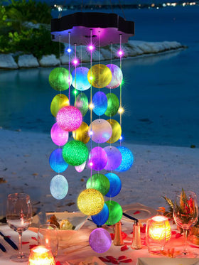 Toodour solar wind chimes outdoors with pastel shells, for ambient garden lighting at dusk