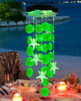 Toodour solar wind chimes with seashells illuminate porches at night with coastal ambiance.