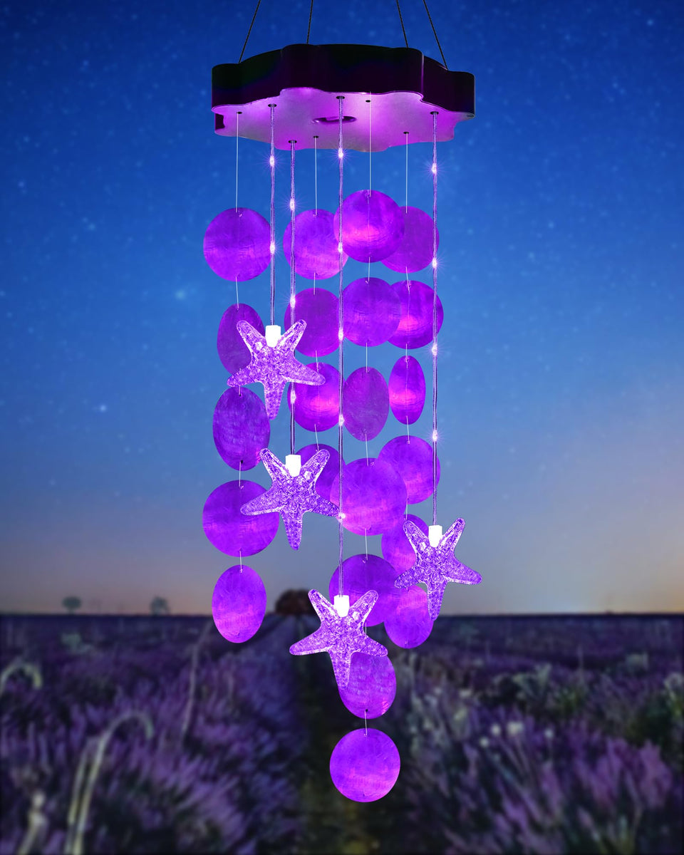 Toodour solar wind chimes with seashells glow purple for outdoor décor at night.