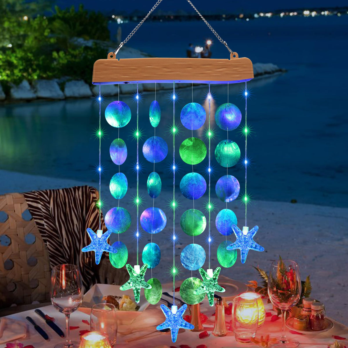 Toodour solar wind chimes with blue-green shells glow softly outdoors for tranquil patio ambiance.