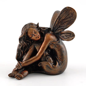 Top Collection Fairy Napping Statue in a garden setting adds whimsical charm to outdoor spaces.