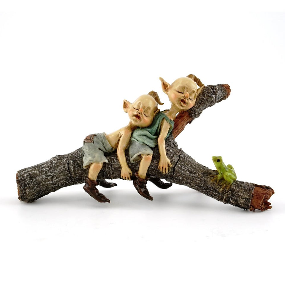 Top Collection miniature fairy pixies napping on a tree log adds whimsical charm to any garden.