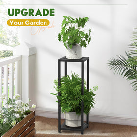 TOSKING black metal plant stand placed in living room enhances decor.