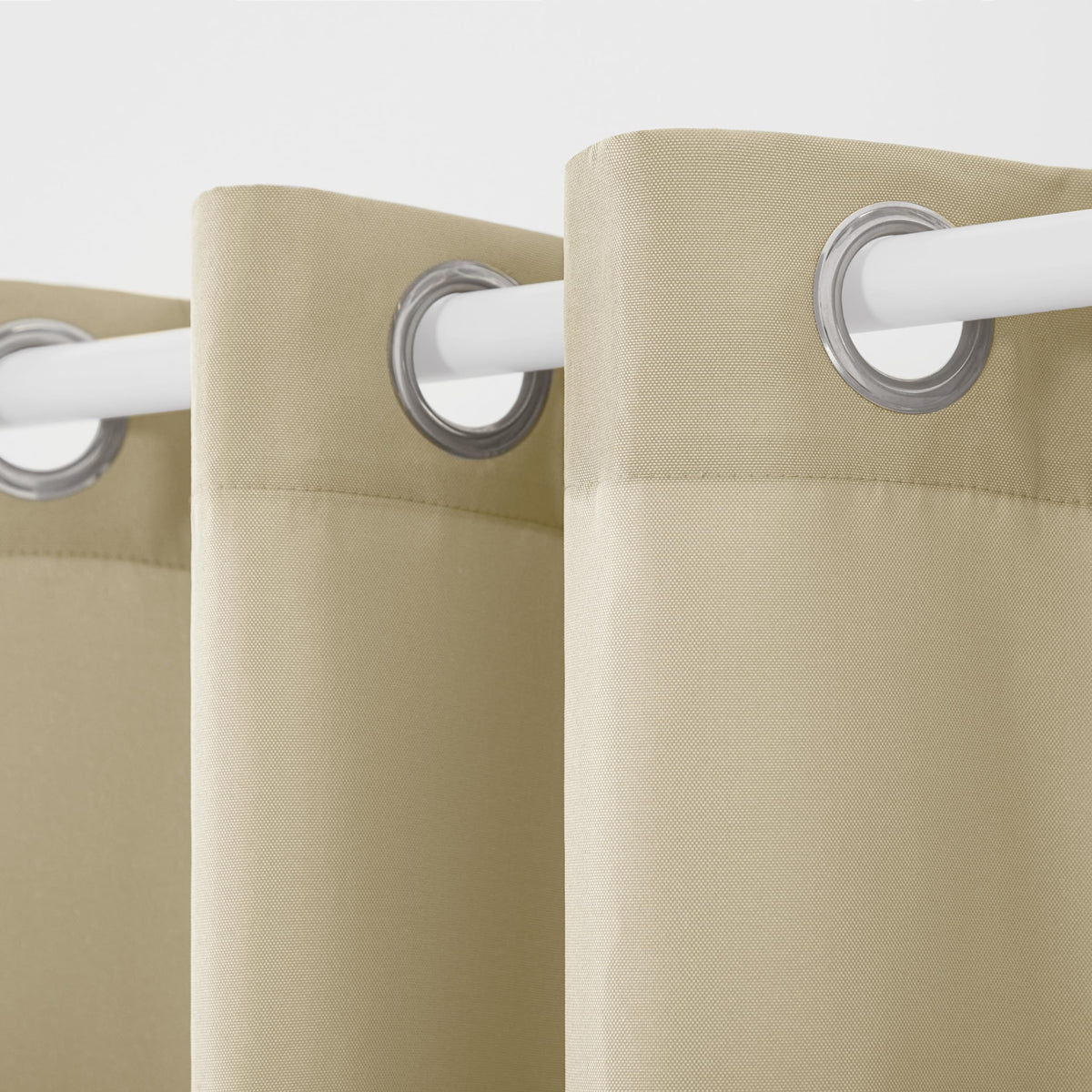 Town & Country Basics Cabana Solid Grommet-Top Curtain with eight stainless steel grommets for easy hanging.